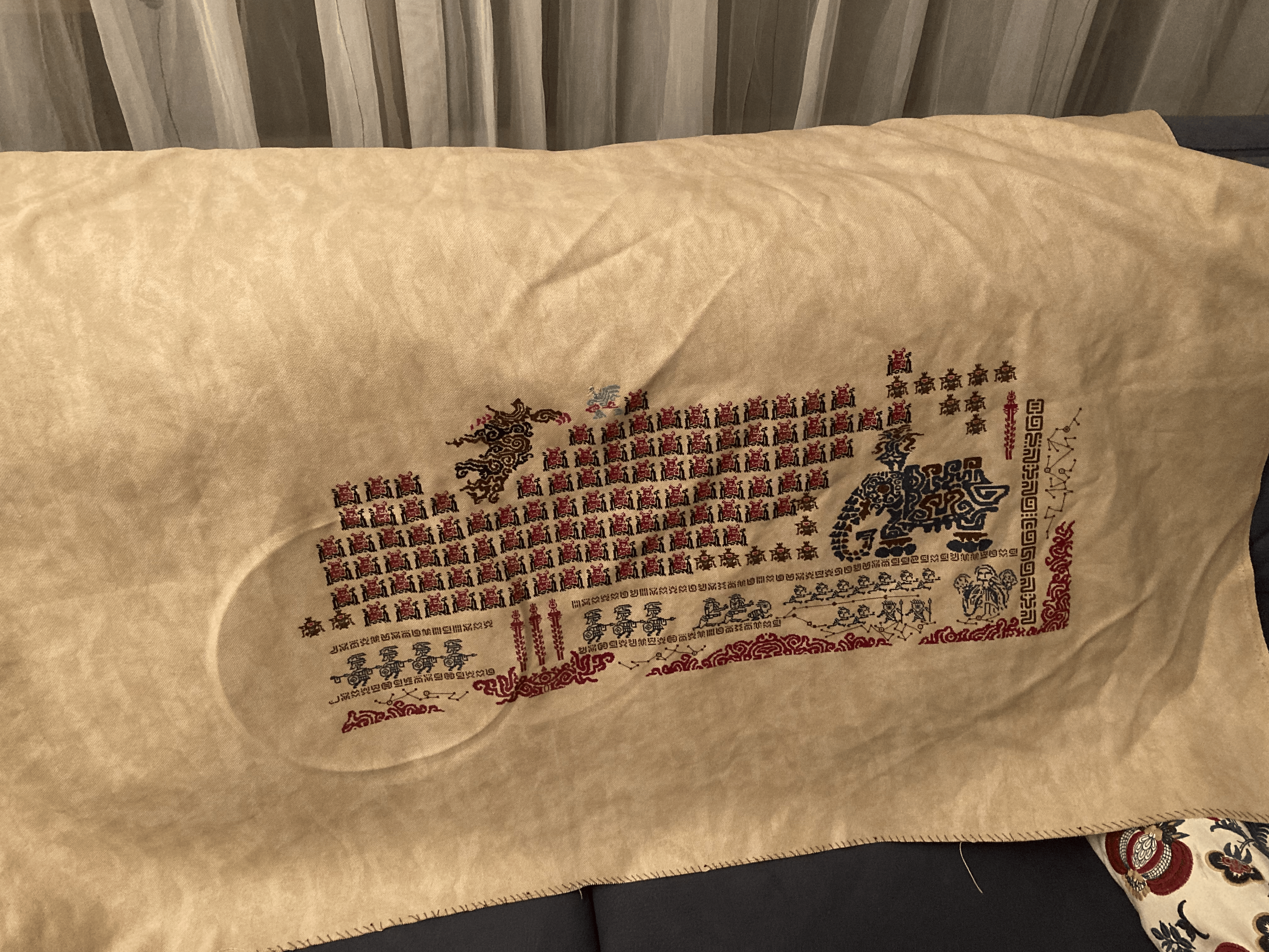 A large piece of fabric laid over a couch